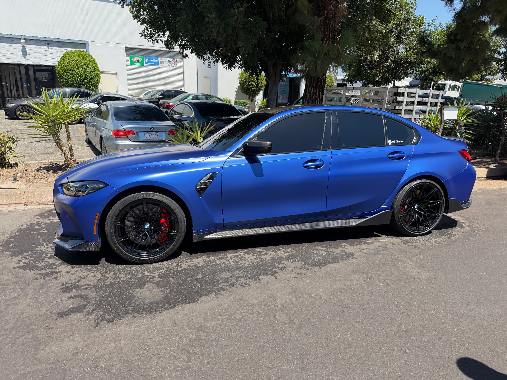 Blue performance sedan side profile after detail